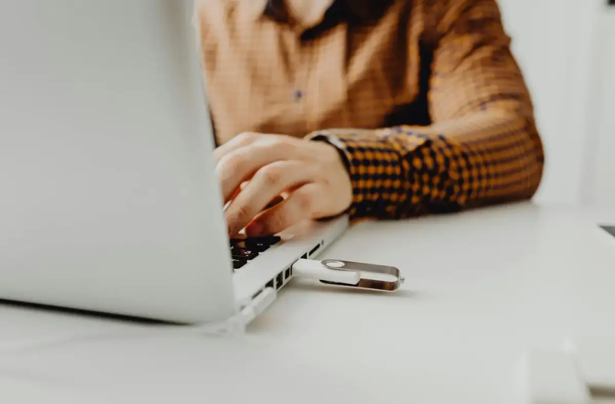 USB flash drive connected to a laptop for boot media