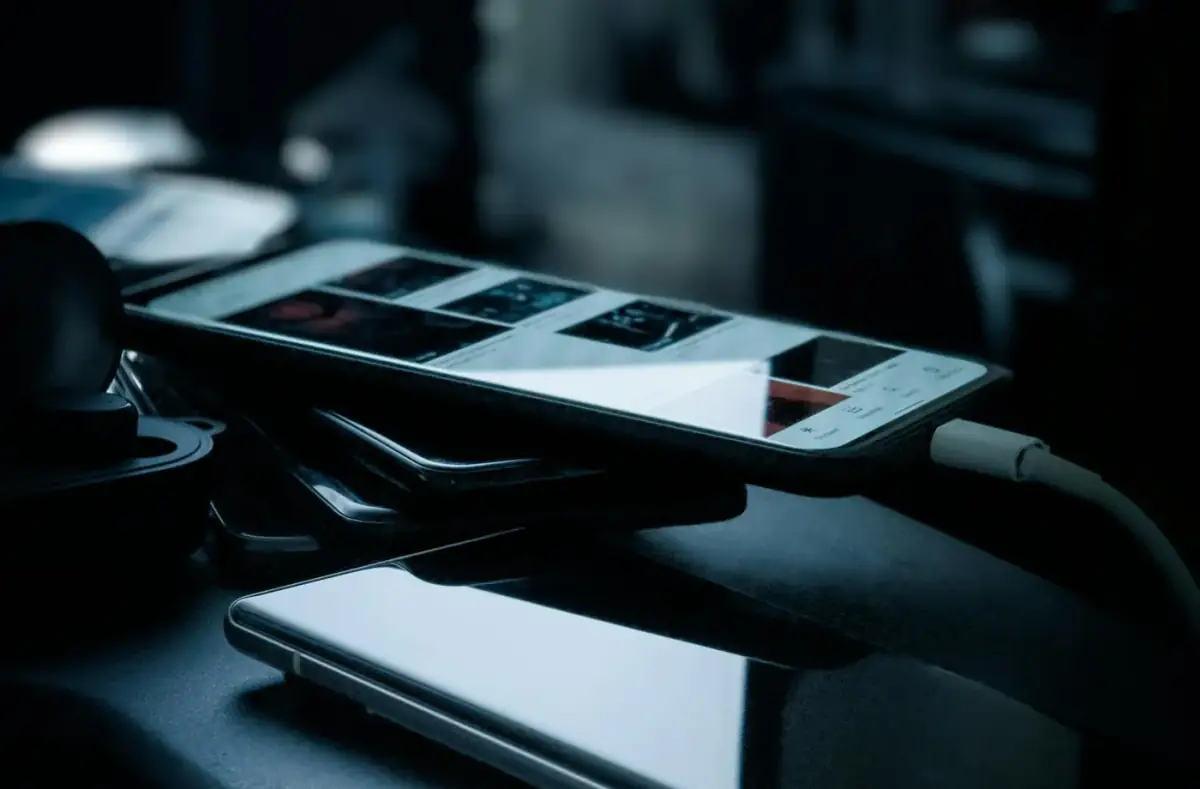 Generic smartphone charging on a dark desk